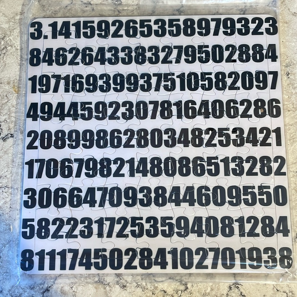 NWOT. 70 piece Pi puzzle in frame.